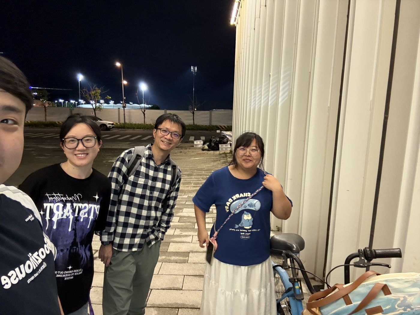 Lab members outside on campus at night
