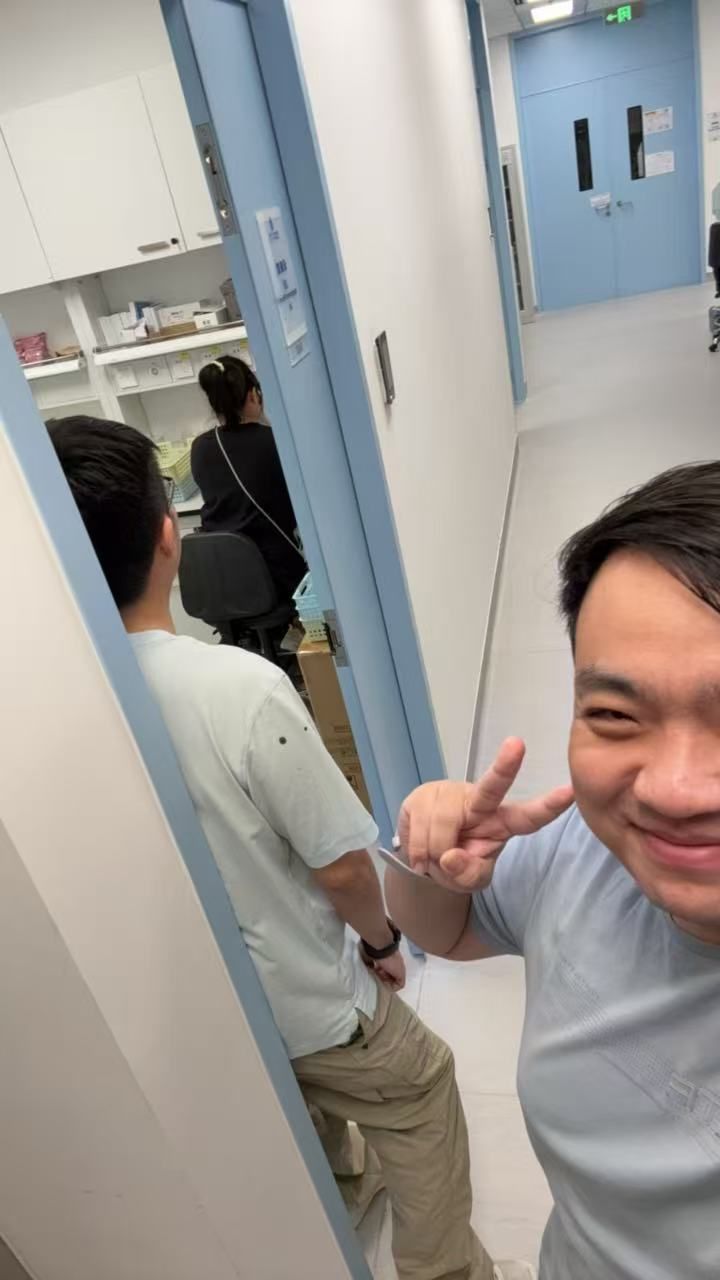 Lab member taking a selfie in the lab corridor