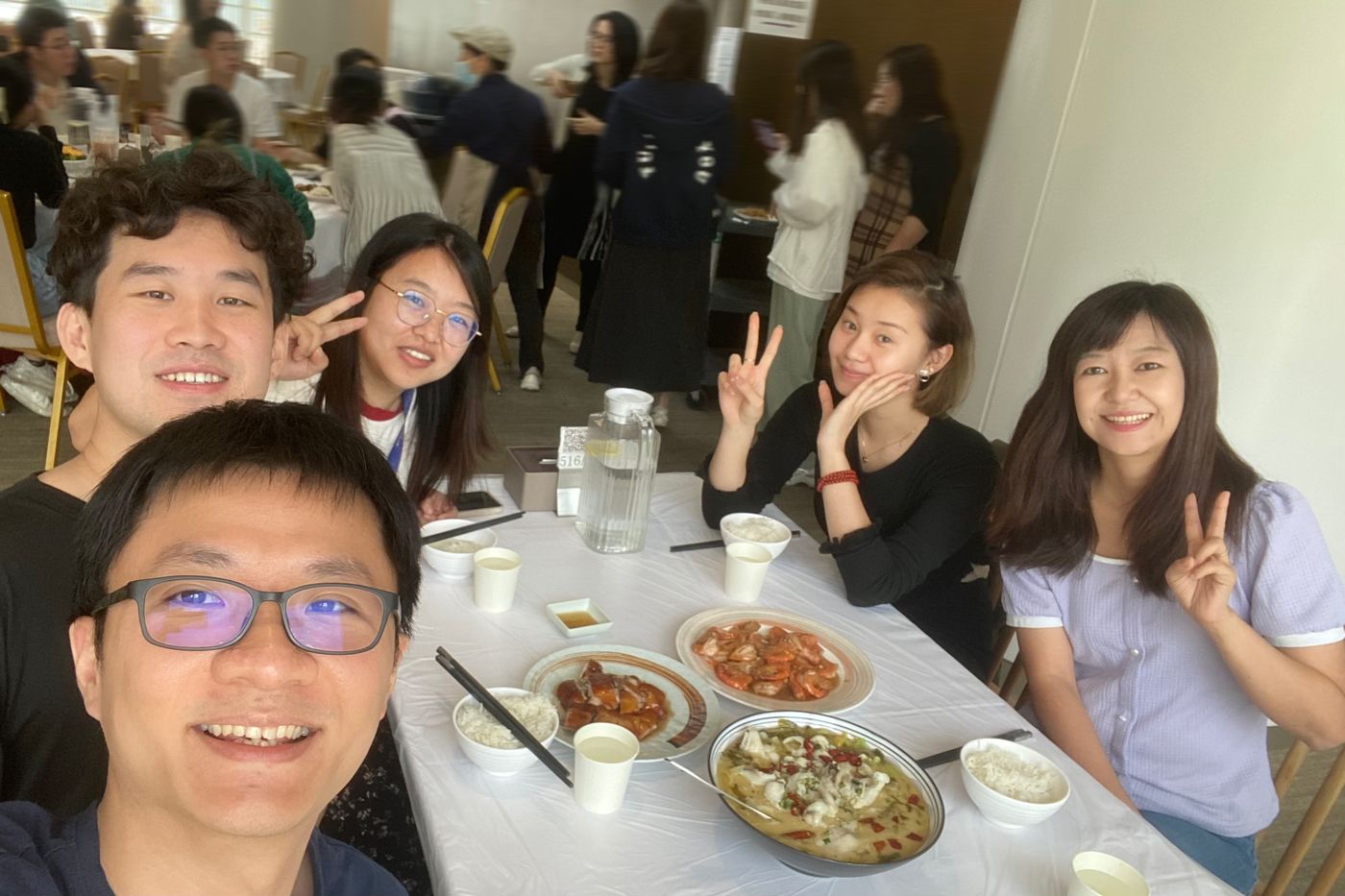 Lab members at a lunch table during a department event